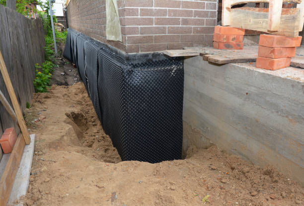 SJ Waterproofing Pros technician performing targeted Sump Pump Installation assessment in Arlington, TN